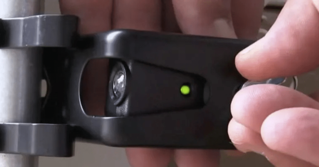 Adjusting a garage door safety sensor.