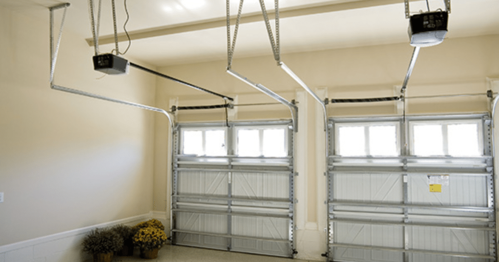 Double garage doors with openers above.