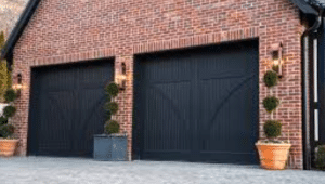 Black Garage Doors on a Red Brick House