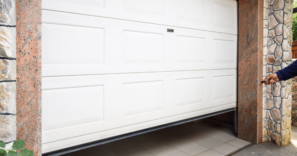 White garage door opening with remote